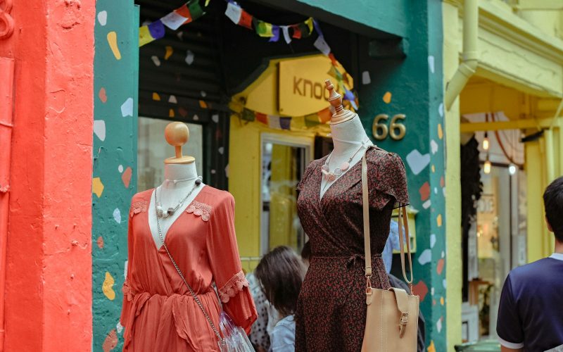 people standing near dress outdoor during daytime